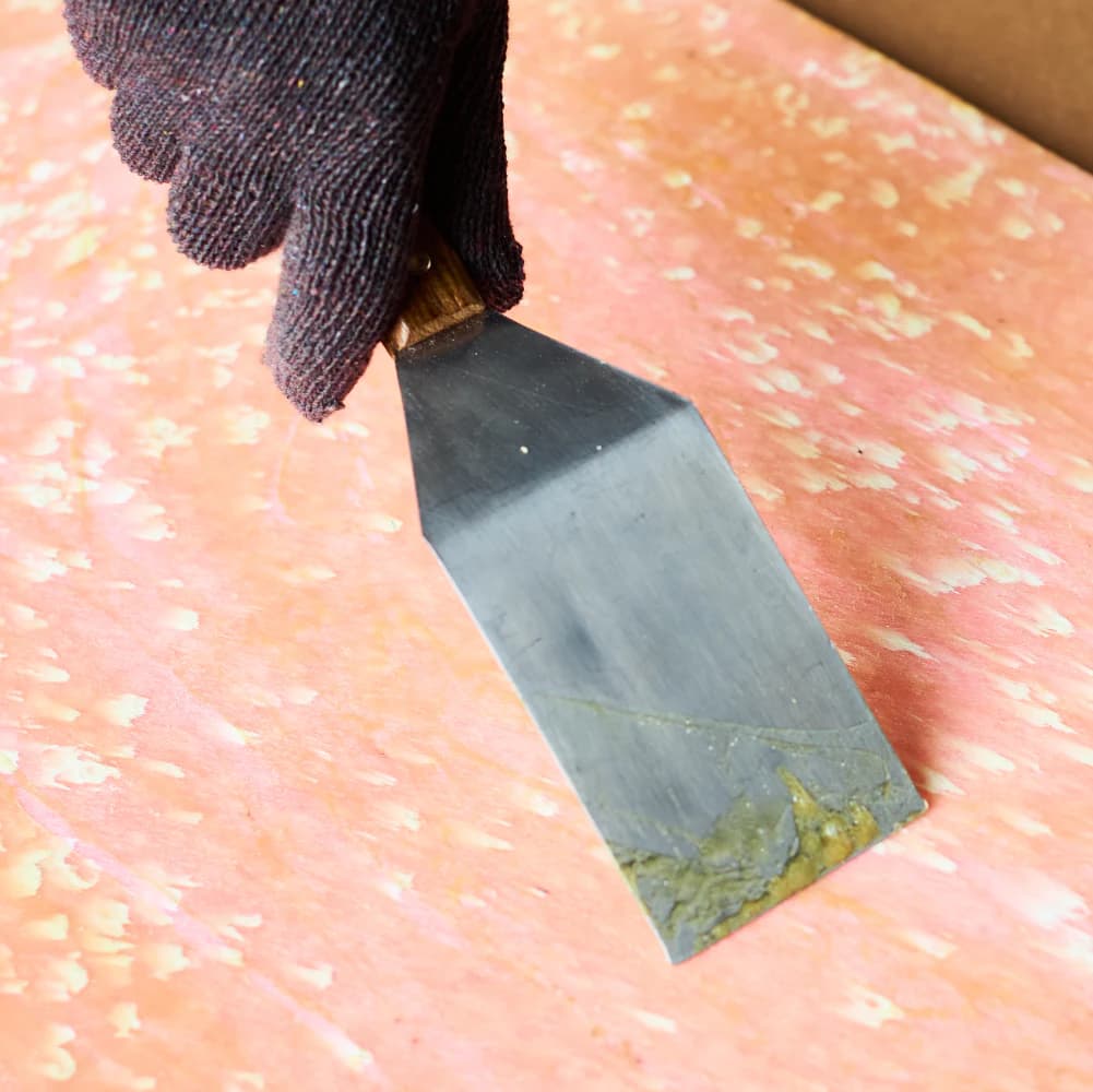 Applying adhesive to Robries Polymer Sheet